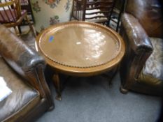 A copper tray top circular coffee table, 83 cms