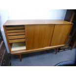 Clausen and Son, 1960s a Danish teak sideboard having three sliding doors, the interior fitted