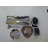 A silver lot comprising of a Tiffany trinket dish, a small photoframe marked '800' a heart trinket