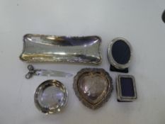 A silver lot comprising of a Tiffany trinket dish, a small photoframe marked '800' a heart trinket