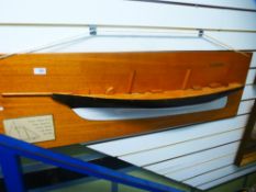 A half hull model of schooner 'America' on mahogany plaque, with two associated books