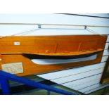 A half hull model of schooner 'America' on mahogany plaque, with two associated books