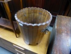 An oak planter having iron handles, diameter 40 cms