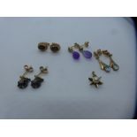 Four pairs of 9ct yellow gold earrings including pair of garnet studs, amethyst drop and