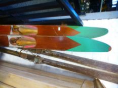 A pair of vintage wooden water skis by Gilcraft and a pair of vintage snow skis