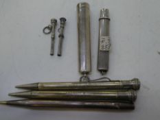 A collection of stationery equipment including silver and white metal items. One silver Yard O Led