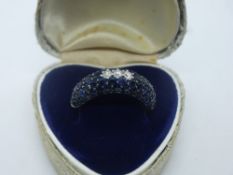 18ct white gold sapphire set band with 3 central diamonds, marked 750, size P, total weight approx