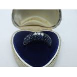 18ct white gold sapphire set band with 3 central diamonds, marked 750, size P, total weight approx