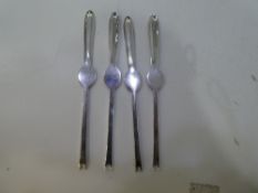 A set of four white metal Lobster forks marked James Dixon and Sons - since 1890. Weight approx 4.