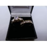 Two 9ct yellow gold dress rings set with cubic zirconias, marked 375, size P/Q. 5.2g