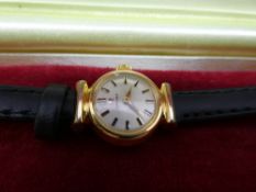 Vintage ladies Omega wristwatch with black leather strap in an Omega presentation box, very light