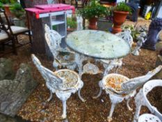 A set of four Victorian cast iron garden chairs and a Britannia cast iron table with circular marble