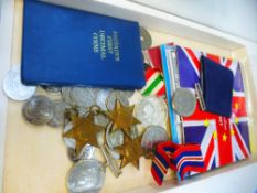 Five WWII medals to include the Africa and Italy Star, coins and sundry