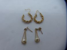 Pair of rope twist design 9ct yellow gold hoop earrings and a pair of hallmarked 9ct drop earrings