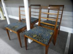A set of four teak G plan dining chairs, having ladderback