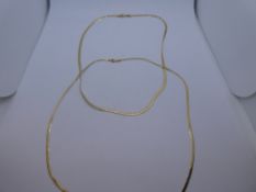 Two fine flat yellow gold necklaces, stamped 9K, weight approx 5.6g