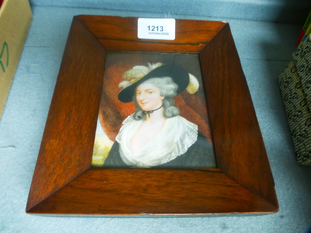 An antique minature portrait of lady wearing hat, 19th century, in rosewood frame, with details on