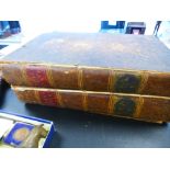 The family Bible circa 1800 in two volumes, brown full leather bindings, front covers detached by