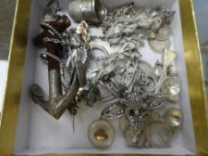 A collection of silver costume jewellery to include a silver and marcasite brooch, enamelled