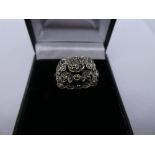 Yellow gold and silver dress ring with floral marcasite panel, size N, 4.5g