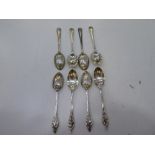 Two sets of four Edwardian and Late Victorian silver teaspoons. One with beaded embossed edge design