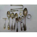 A lot comprising of silver tableware of spoons, tongs etc some Irish silver, continental and