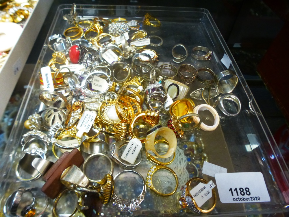 A tray of costume rings and similar