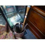 A leather shot bucket, a horse whip and 2 other items