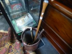 A leather shot bucket, a horse whip and 2 other items