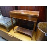 A minature Edwardian mahogany foldover tea table having chequer inlay and undertier, 55.5 cms