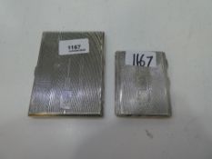 Two silver cigarette cases with silver gilt interior and of engine turned design exterior. One