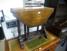 An old carved oak two flap side table, having octagonal top, 74.5 cms