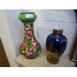 A Wemyss baluster vase, decorated roses, the base stamped 'Made in Scotland for W Rowland and Son,