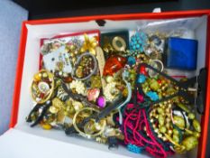 A box file containing costume jewellery