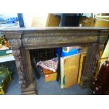 A late Victorian carved oak fire surround / mantelpiece, 160 cms