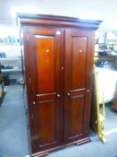 A modern mahogany style two door wardrobe, 111 cms