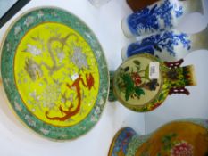 A Chinese yellow plate decorated two dragons, with green edge, 24 cms and a Chinese moonflask