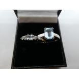Two contemporary dress rings, set with pale blue stones, both marked 375, size S, weight approx 4g