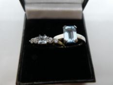 Two contemporary dress rings, set with pale blue stones, both marked 375, size S, weight approx 4g