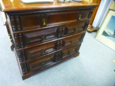 An antique oak chest, having four long draweers, late 17th/early 18th century, 97 cms