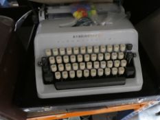 Selection of vintage typewriters, projector, etc