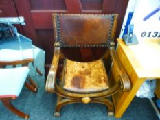 A reproduction throne style chair having leather upholstery