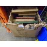 A box of vintage hard back books and vintage annuals of various themes