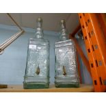 Two glass oil decanters