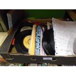 Box of 7 inch vinyl including Status Quo and Beetles, etc