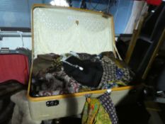 Vintage suitcases containing scarves, cravats, ties, etc