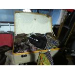 Vintage suitcases containing scarves, cravats, ties, etc