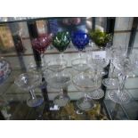 Four coloured crystal glasses with three similar cut glasses, along with 6 Babycham glasses