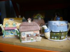 Collection of teapots in the form of shops and houses