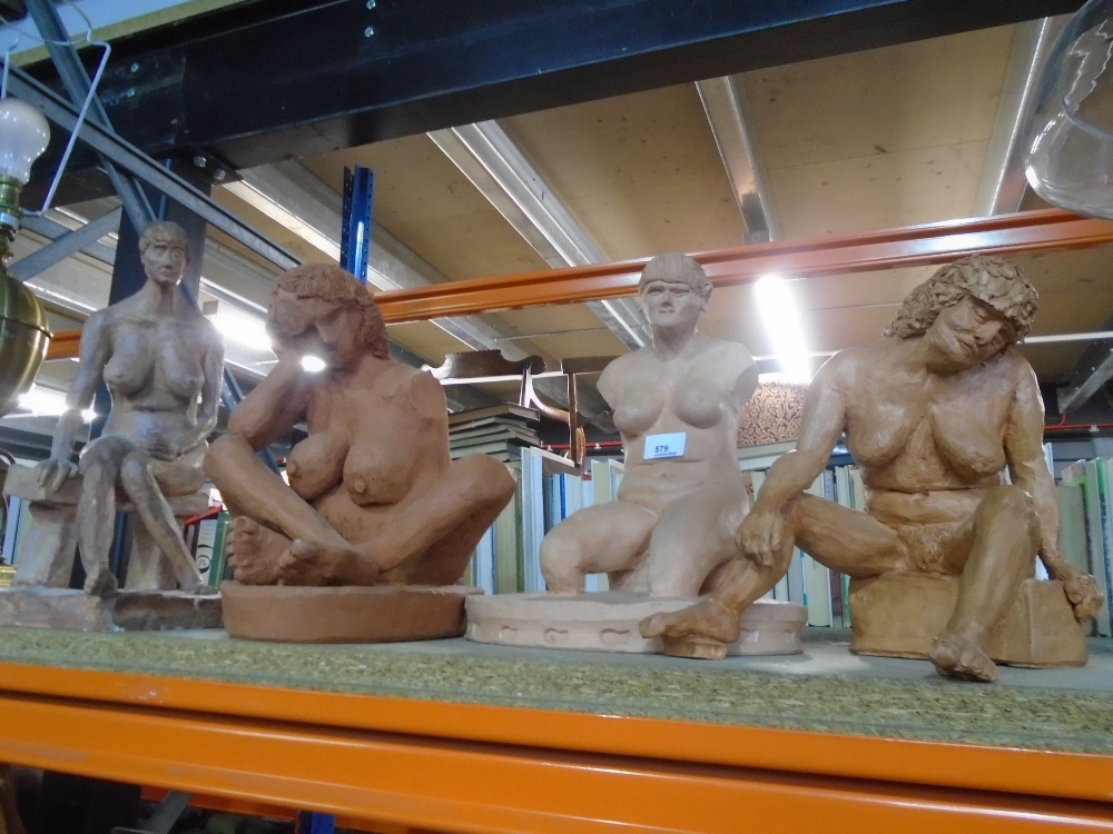 Four clay sculptures of desirable women